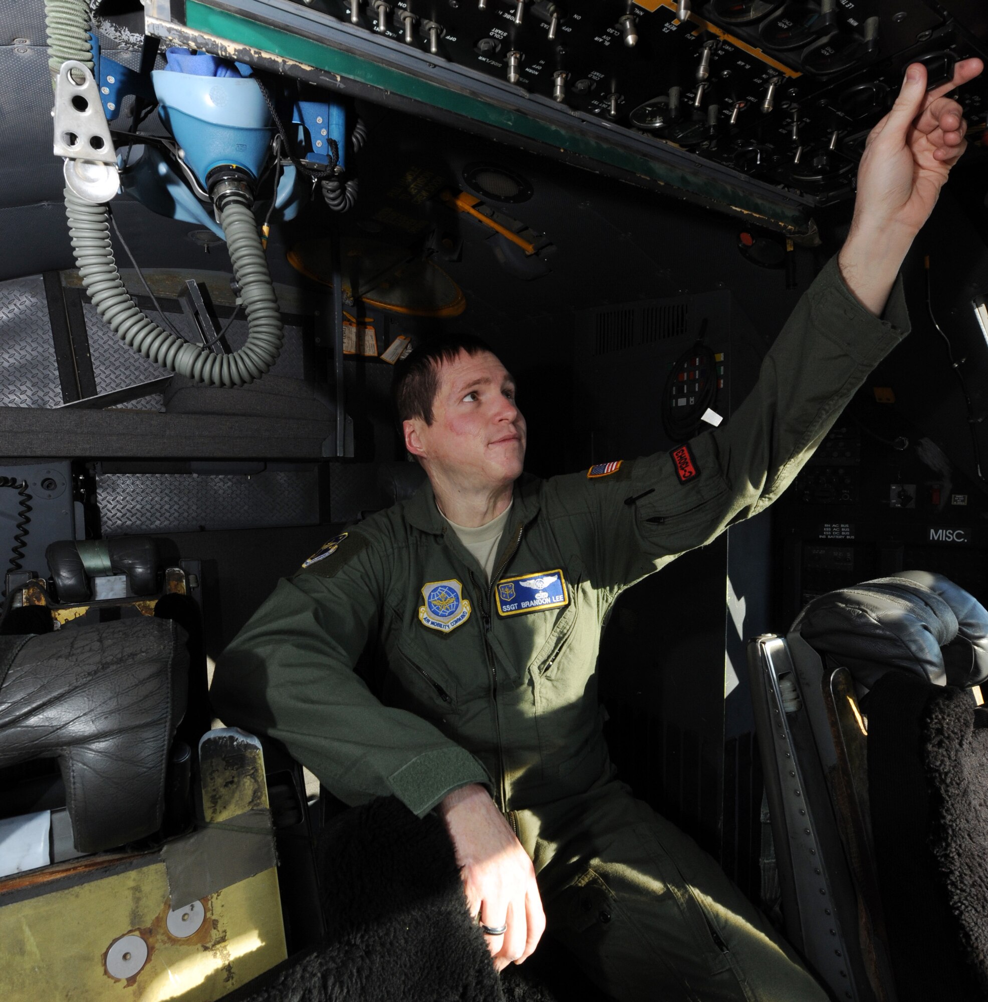 Staff Sgt. Brandon Lee, the 19th Operations Group flight engineer, performs a cockpit check prior to take off inside a C-130, Jan. 3, 2012, at Little Rock Air Force Base, Ark. Lee maintains and distributes flight publications for six operations squadrons and four different aircraft. (U.S. Air Force photo by Airman 1st Class Rusty Frank)