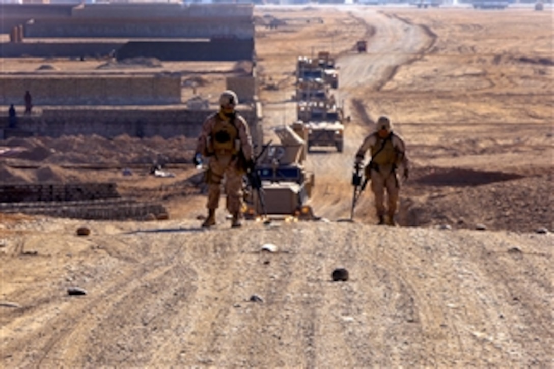 U.S. Marines use metal detectors to sweep a hill during a route reconnaissance mission of Route Red, which extends from Highway 1 to Shir Ghazay, Afghanistan, on Jan. 1, 2012.  The Marines are assigned to the 2nd Platoon, Alpha Company, 9th Engineer Support Battalion, 2nd Marine Logistics Group.  The purpose of the mission was to document inclines and declines in the route, sharpness of curves, the shortest width during the route, and where culverts were located or needed to be placed.  