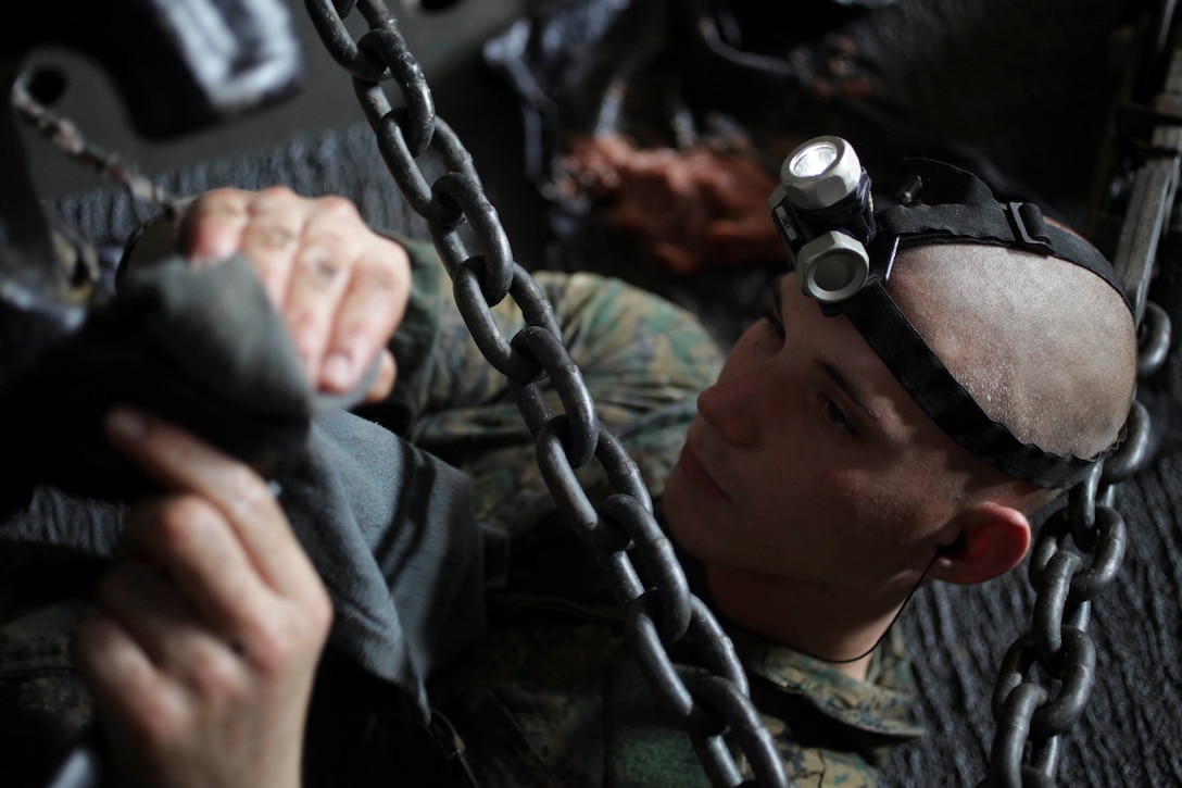 Rifleman Lance Cpl. Wil Dewitt maintains a light-armored vehicle aboard USS Makin Island (LHD 8) here Jan. 9. Dewitt, 20, who hails from Hammond, Ind., serves with Weapons Company, Battalion Landing Team 3/1. The team is the ground combat element for the 11th Marine Expeditionary Unit. The 11th MEU is currently deployed as part of the Makin Island Amphibious Ready Group (MKIARG) as the U.S. Central Command theater reserve force, also providing support for maritime security operations and theater security cooperation efforts in the U.S. 5th Fleet area of responsibility.