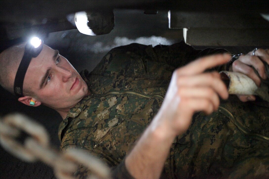 Lance Cpl. Chase Chowning maintains a light-armored vehicle aboard USS Makin Island (LHD 8) here Jan. 9. Chowning, 20, who hails from Clarkfork, Idaho, serves as a light-armored reconnaissance mechanic with Weapons Company, Battalion Landing Team 3/1. The team is the ground combat element for the 11th Marine Expeditionary Unit. The 11th MEU is currently deployed as part of the Makin Island Amphibious Ready Group (MKIARG) as the U.S. Central Command theater reserve force, also providing support for maritime security operations and theater security cooperation efforts in the U.S. 5th Fleet area of responsibility.