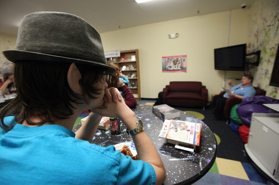 Service member children gathered for the Teen Reads program hosted by Marine Corps Community Services at the Harriotte B. Smith Library aboard Marine Corps Base Camp Lejeune, recently. The teenagers get together once a month to have group discussions about the readings.