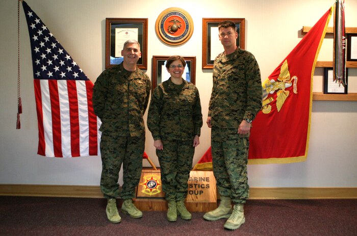 (From left to right) Navy Capt. Gregory N. Todd, the 2nd Marine Logistics Group Chaplain, Rear Admiral Margaret Kibben, the Chaplain of the Marine Corps, and Col. Mark Hollahan, the 2nd Marine Logistics Group commanding officer, pose for a photo Jan. 10, 2012, aboard Camp Lejeune, N.C.  Kibben visited Camp Lejeune to meet with Marine and Navy leaders, chaplains and religious program specialists. (Photo by Cpl. Bruno J. Bego)