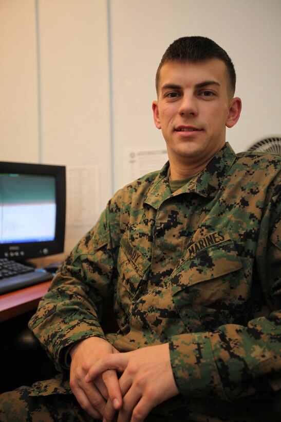 Cpl. Jacob Grady, the intelligence chief with Marine Heavy Helicopter Squadron 366 works at his desk during a typical work day Jan 10.