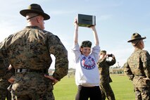 Gunnery Sgt. Adam Blake watches Molly McCurdy, a counselor at Como Park High School, conduct the ammo can lift portion of a combat fitness test Jan. 10 during the Recruiting Station Twin Cities 2012 Educators Workshop. For additional imagery from the event, visit www.facebook.com/rstwincities.