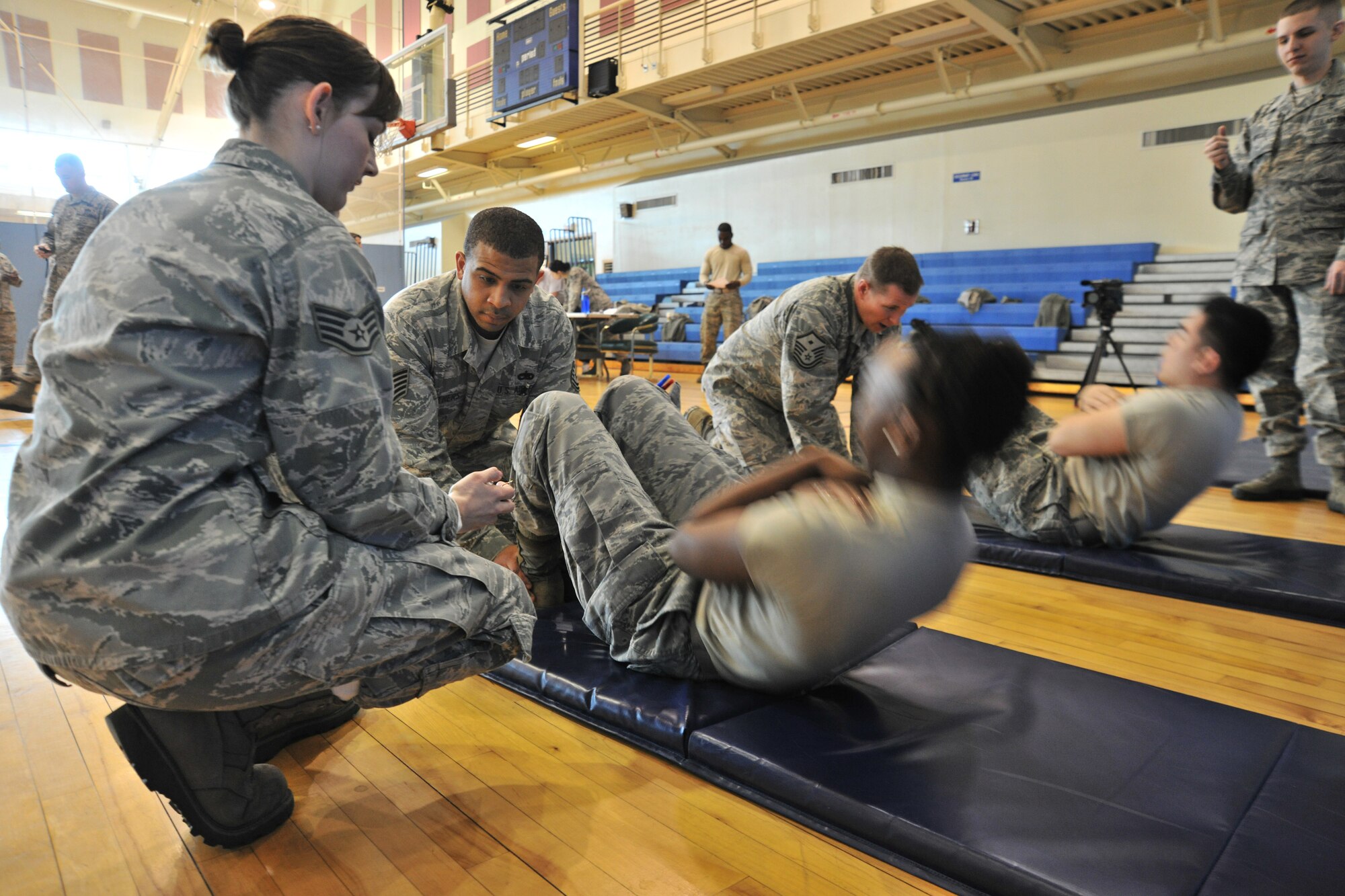 Airmen participate in a push-up and sit-up challenge at Kunsan Air Base, Republic of Korea, Jan. 10, 2012. All pledges go toward the Wolf Pack Annual Awards. (U.S. Air Force photo by Senior Airman Brittany Y. Auld/Released)