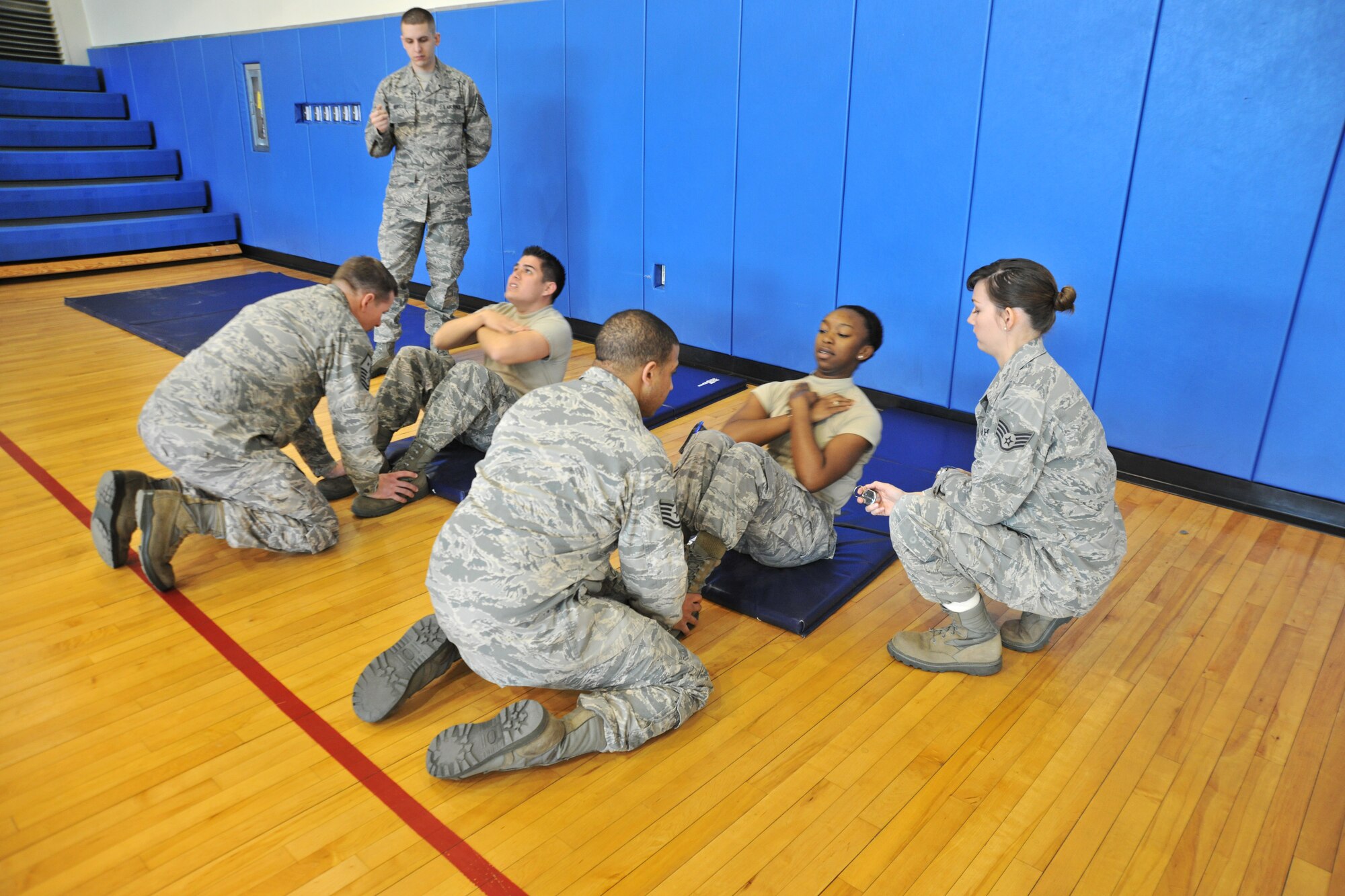 Airmen participate in a push-up and sit-up challenge at Kunsan Air Base, Republic of Korea, Jan. 10, 2012. All pledges go toward the Wolf Pack Annual Awards. (U.S. Air Force photo by Senior Airman Brittany Y. Auld/Released)