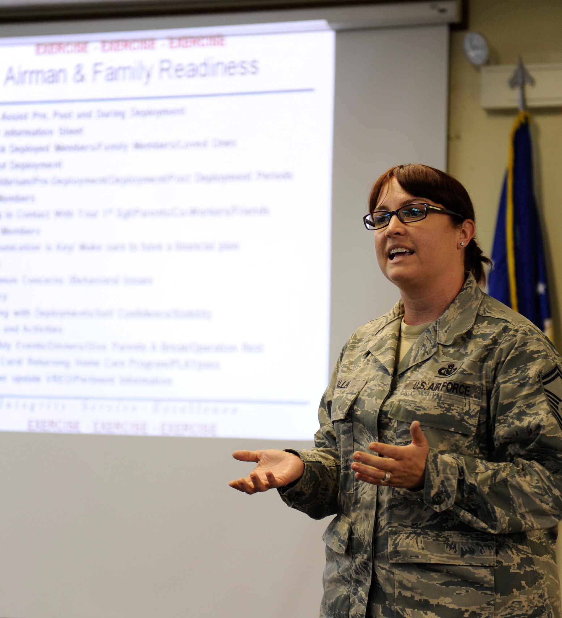 Senior Master Sgt. Michele Allen, 18th Force Support Squadron NCO in charge of readiness at the Airman and Family Readiness Center, briefs Airmen about entitlements and family aid during a pre-deployment briefing as part of Beverly High 12-2, a local operational readiness exercise on Kadena Air Base, Japan, Jan 10. Phase one of the LORE is focused on deployment preparation. (U.S. Air Force photo by Airman 1st Class Maeson L. Elleman/Released)