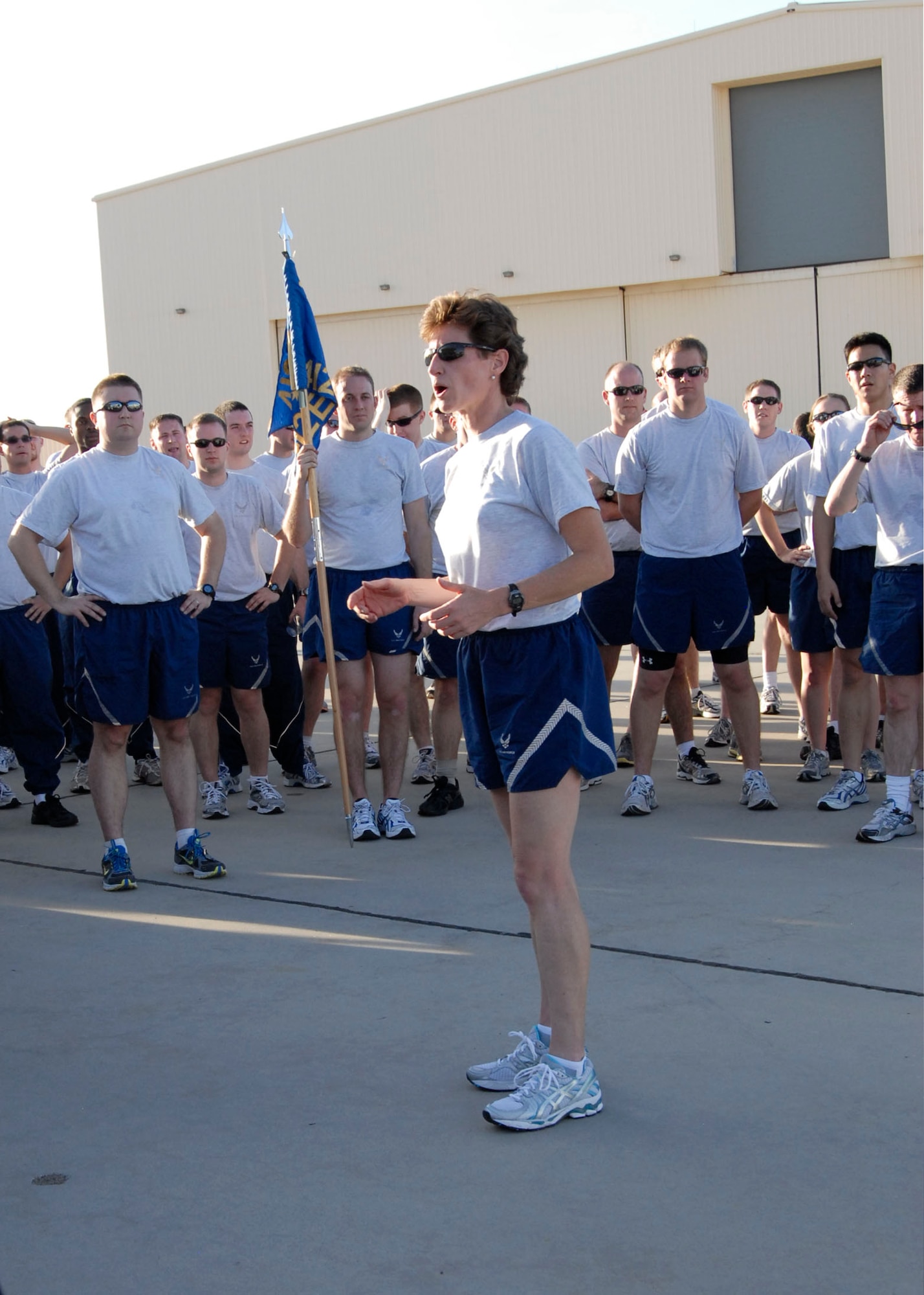 Col. Dawn M. Dunlop, commander, 412th Test Wing, thanks members of the wing for their participation in the annual Back in the Saddle event, on Jan. 3. The first day back after the beginning of a new year was dedicated to "mitigating the human element." Fitness and teamwork are key pillars in maximizing the efforts of the 412th Test Wing and allowing them to be successful in their mission of flight test. (U.S. Air Force Photo by Laura Mowry)