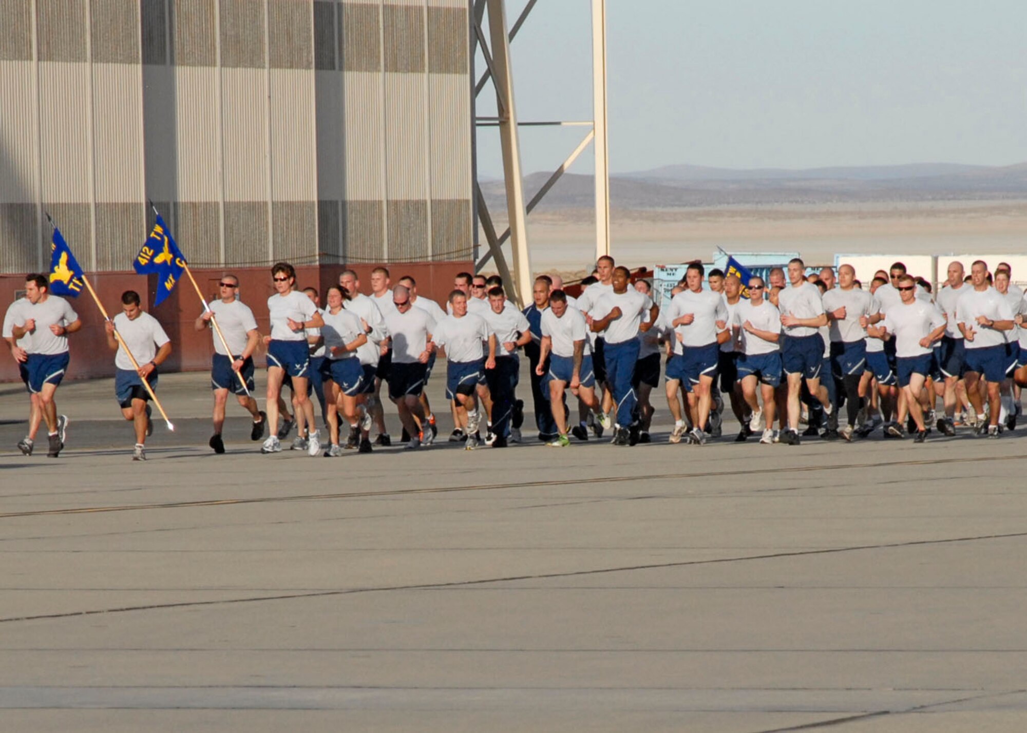 Members of the 412th Test Wing take a two-mile run on the historic Edwards flightline to round out Back in the Saddle day, the wing’s annual event that highlights the importance of safety, fitness, and teamwork to accomplish the mission of flight test. (U.S. Air Force Photo by Laura Mowry)