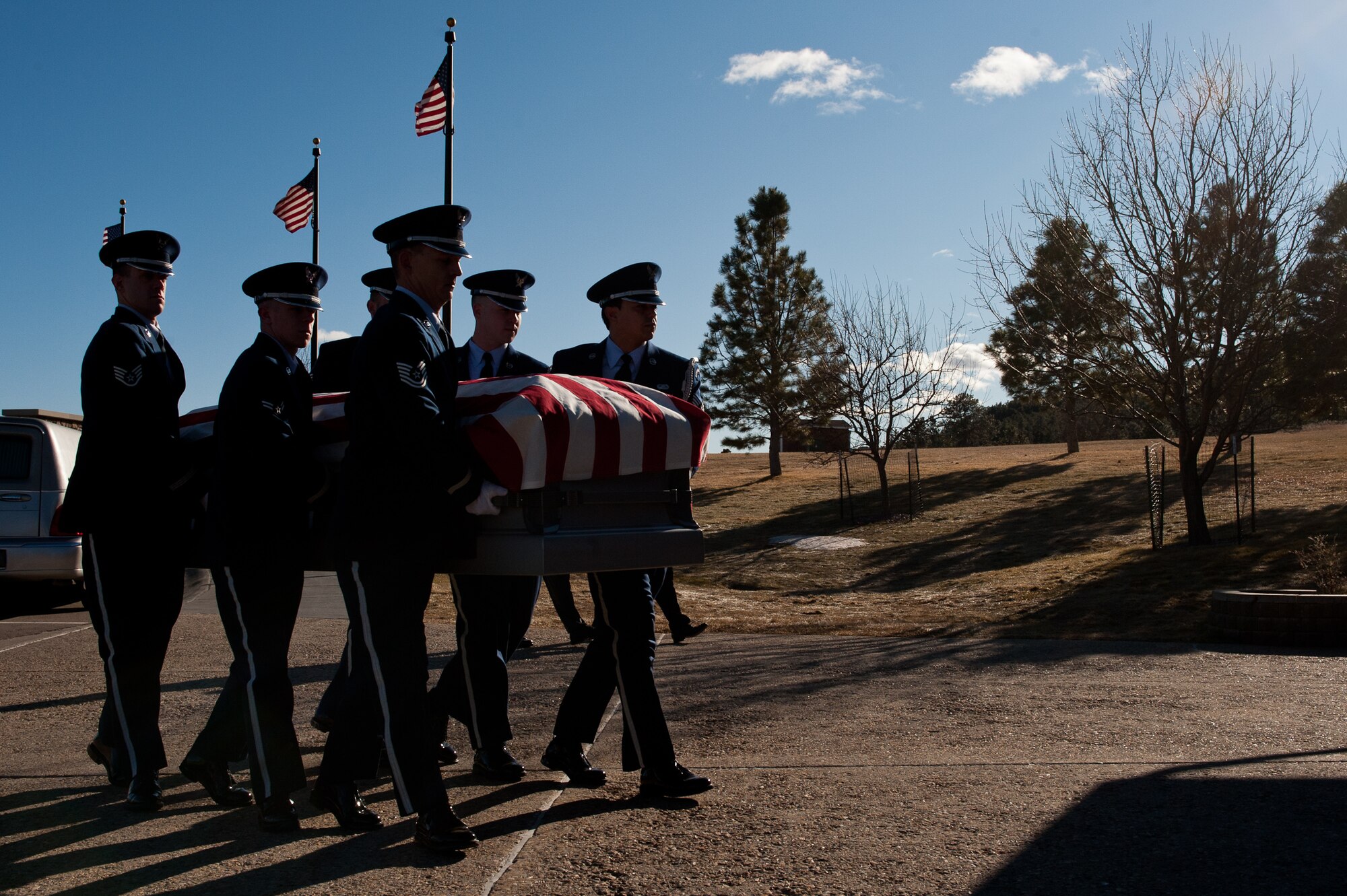 Airmen of the Ellsworth Air Force Base Honor Guard carry a casket during a funeral at the Black Hills National Cemetery near Sturgis, S.D., Jan. 6, 2012. The base Honor Guard performs a variety of military honors for active-duty servicemembers and U.S. military retirees. (U.S. Air Force photo by Airman 1st Class Kate Thornton/Released)