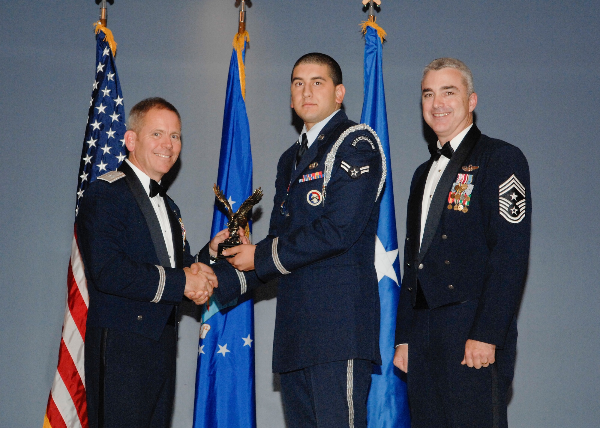 Base Honor Guard Member of the Year was awarded to Airman 1st Class Nicholas Puente, 325th Air Control Squadron pilot simulator, in a ceremony Jan. 6 at the Heritage Club. (U.S Air Force photo by Chris Cokeing)