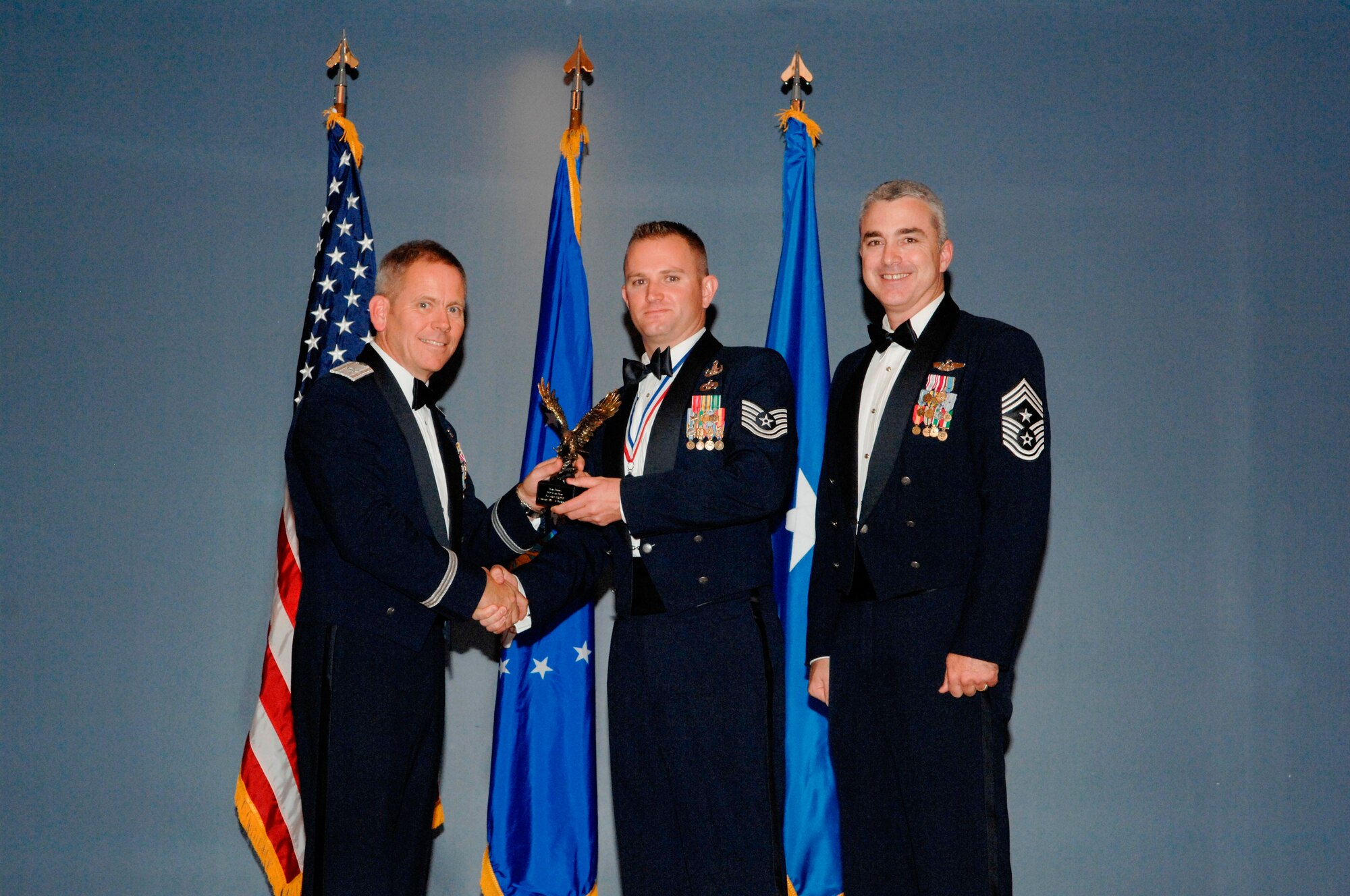 Non-Commissioned Officer of the Year was awarded to Technical Sergeant Aris M. DiRodio, 823nd RED HORSE Squadron, Detachment 1, Explosive Ordinance Disposal Combat Battlefield Ready Airman instructor, in a ceremony Jan. 6 at the Heritage Club. (U.S Air Force photo by Chris Cokeing)