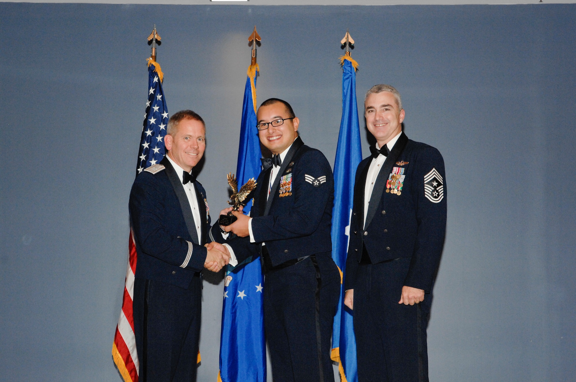 Airman of the Year was awarded to Senior Airman Guadalupe Corona, 325th Civil Engineer Squadron explosive ordinance disposal journeyman, in a ceremony Jan. 6 at the Heritage Club. (U.S Air Force photo by Chris Cokeing)