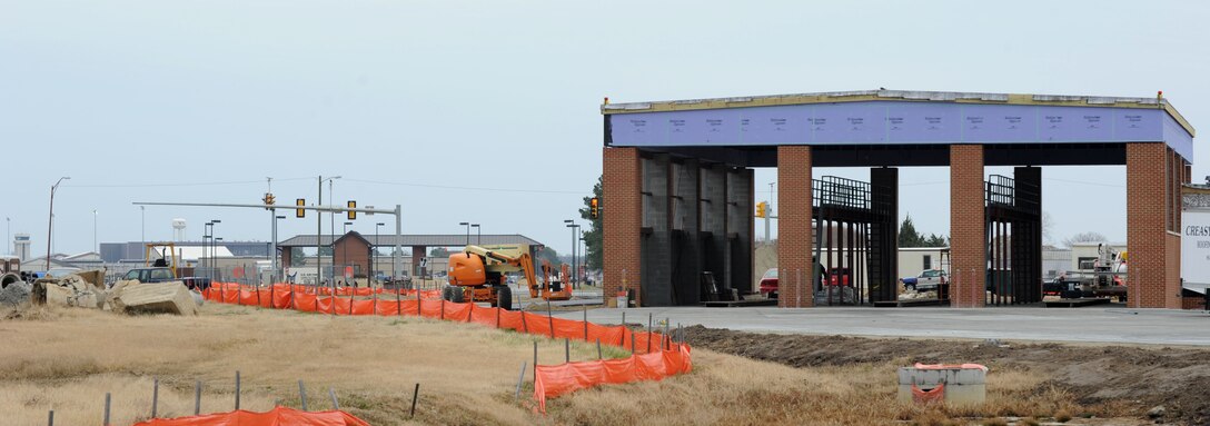 Construction workers execute plans for a new tractor trailer check point outside the West Gate at Langley Air Force Base, Va., Jan. 9, 2011. There are multiple construction projects happening on the installation that may impact traffic patterns, continue to read the Peninsula Warrior for updates. (U.S. Air Force photo by Airman 1st Class Racheal Watson/Released)