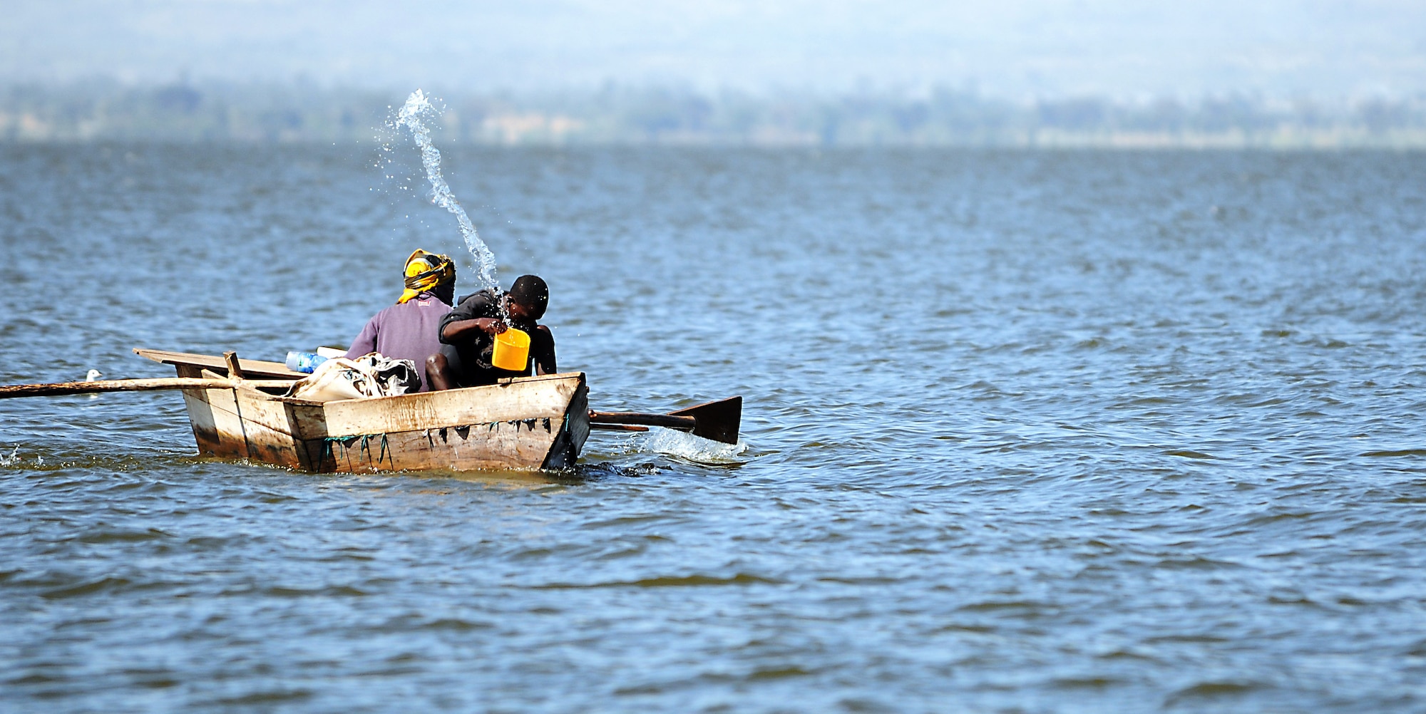 A fisherman bails water from a handmade boat while fishing at a lake in Hawassa, Ethiopia, Dec. 8, 2011. According to Addisu Wedhao, the attache to the U.S. embassy in Ethiopia, many of the tools and devices used to hunt, fish and grow crops in Ethiopia are made by hand. (U.S. Air Force photo/Senior Airman Jarad Denton)