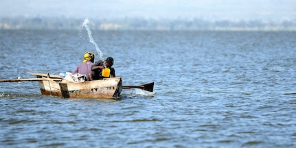 A fisherman bails water from a handmade boat while fishing at a lake in Hawassa, Ethiopia, Dec. 8, 2011. According to Addisu Wedhao, the attache to the U.S. embassy in Ethiopia, many of the tools and devices used to hunt, fish and grow crops in Ethiopia are made by hand. (U.S. Air Force photo/Senior Airman Jarad Denton)