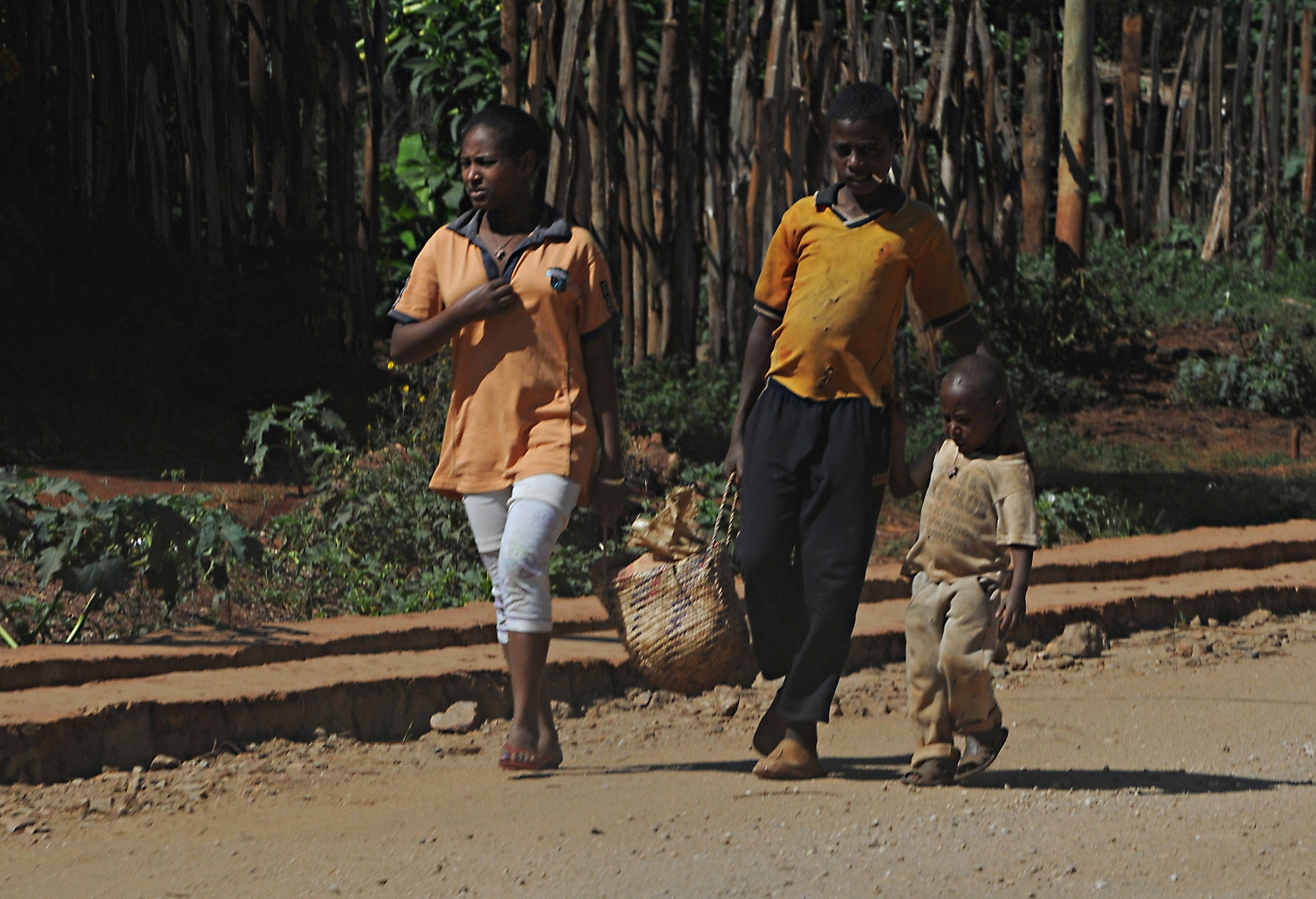 A family walks along the road from Negele Borena, Ethiopia, Dec. 7, 2011. Thanks to the recent completion of a bridge spanning a river in Negele Borena, families like this will be able to cross the water safely. (U.S. Air Force photo/Senior Airman Jarad Denton)