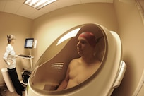 Lorri Tibbetts, Health Promotions Manager at the Joint Base San Antonio-Randolph Health and Wellness Center performs body fat measurements for Staff Sgt Michael Blunt, Air Force Recruiting Service, in the Bod Pod Jan. 10. The Bod Pod is the latest technology in body fat measurement. (U.S. Air Force photo/Rich McFadden) (released)
