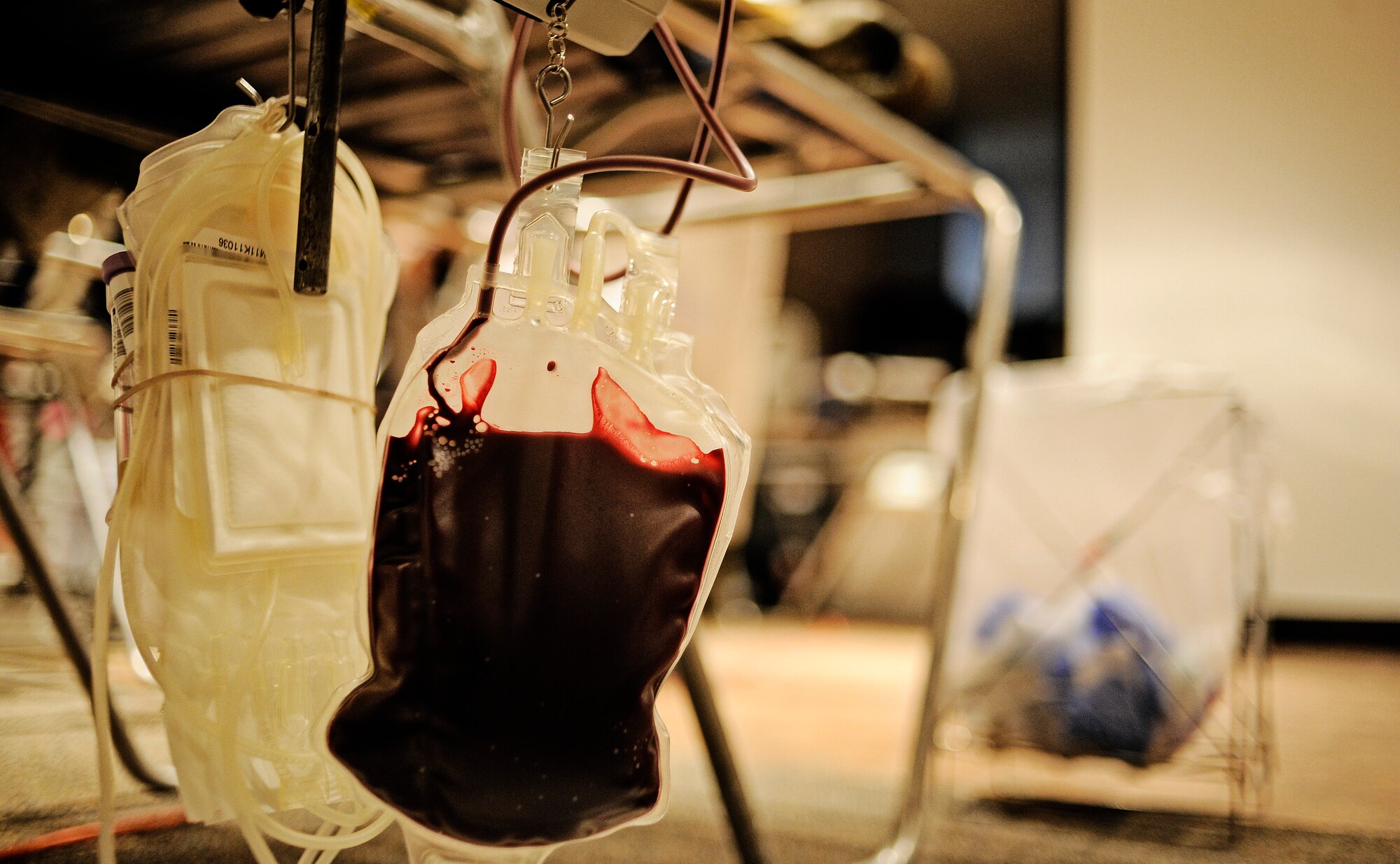 Blood donated by Senior Airman Justin Vaughan, Air Mobility Command intelligence analyst, slowly fills the bag during the first blood drive of the year Jan. 10, 2012. Last year Scott AFB donated more than 950 units of blood, but Col. Michael Hornitschek, 375th Air Mobility Wing commander, wants to beat that goal this year and has set a goal of 120 units for the opening blood drive. (U.S. Air Force photo/ Staff Sgt. Ryan Crane)