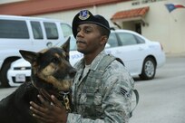 Senior Airman Kevin Banks, 902nd Security Forces Squadron, and his military working dog Kira prepare for the day patrol on Joint Base San Antonio-Randolph Jan. 9.  The 902nd SFS has recently transitioned from 12- to eight-hour shifts. (U.S. Air Force photo/Rich McFadden) (released)