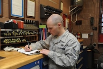 Staff Sgt Johnathan Kuenzli, 902nd Security Forces Squadron, inventories weapons in the armory on Joint Base San Antonio-Randolph Jan. 9.  The 902nd SFS has recently transitioned from 12- to eight-hour shifts. (U.S. Air Force photo/Rich McFadden) (released)