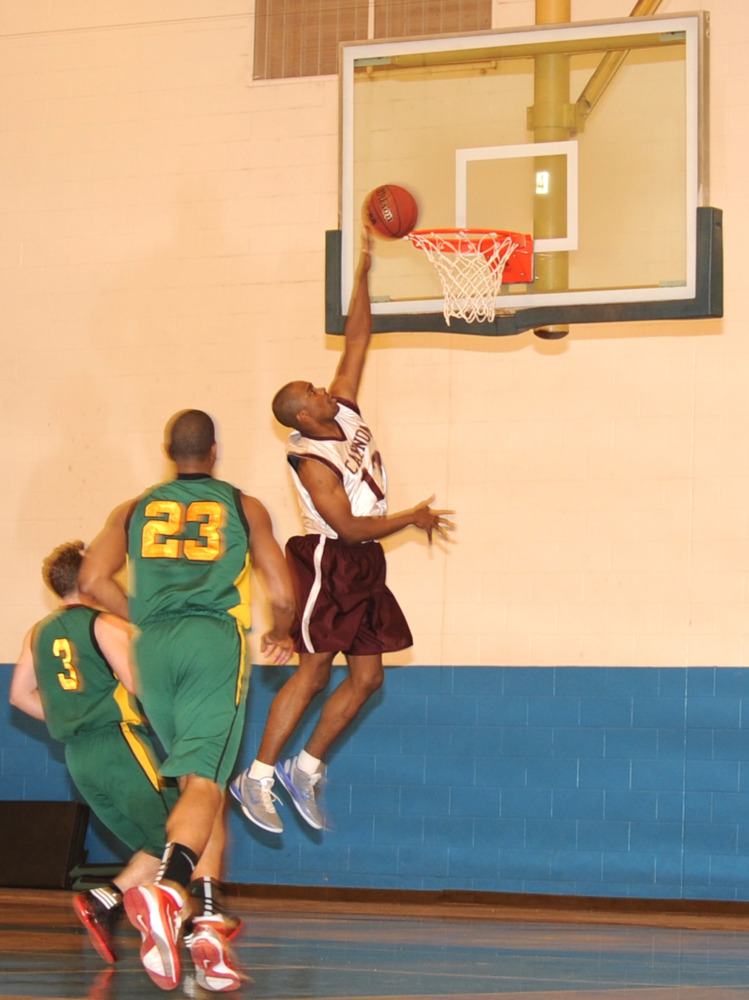 U.S. Air Force Senior Airman Steven McCoy, 27th Special Operations Logistics Readiness Squadron, scores the first basket of the game in the Fitness Center at Cannon Air Force Base, N.M., Jan.7, 2011. Cannon won their first home-game 72-68, besting Dyess Air Force Base, Texas. (U.S. Air Force photo by Airman 1st Class Alexxis Pons Abascal)