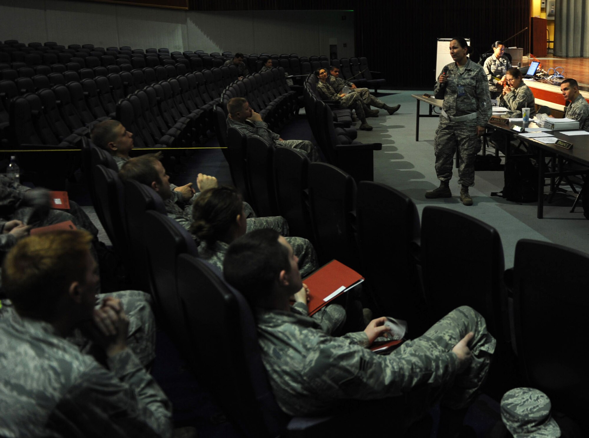 U.S. Air Force Staff Sgt. Alexius Tucker, 18th Wing Legal Office paralegal, gives a briefing at the Keystone Theater during local operational readiness exercise Beverly High 12-2, on Kadena Air Base, Japan, Jan. 10, 2011. LOREs test Kadena Airmen's ability to survive and operate under various conditions. (U.S. Air Force photo by Airman 1st Class Justin Veazie/released)