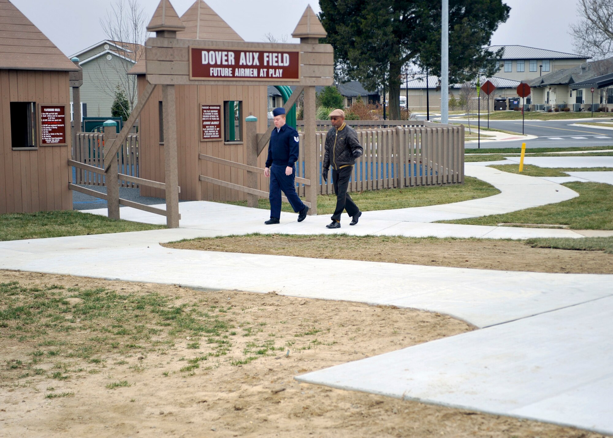 Tech Sgt. Arthur Bradshaw (left) and James Brown, both with the Airman & Family Readiness Center, take a walk Jan. 9, 2012, on the newly installed track around Liberty Park. The walking track is just one of the upgrades added to the park during a recent renovation. The park is part of the base's military construction program, and was funded in part by the Commander in Chief's Installation Excellence Award. (U.S. Air Force photo by Tech. Sgt. Chuck Walker)