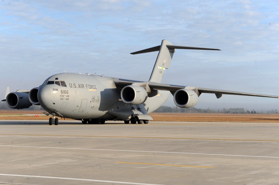 A C-17 Globemaster III taxies in carrying returning Airmen of the 38th Rescue Squadron at Moody Air Force Base, Ga., Jan. 9, 2012. The members returned from a deployment to the horn of Africa. They were welcomed home by base leadership, friends, co-workers and family. (U.S. Air Force photo by Staff Sgt. Ciara Wymbs/Released)