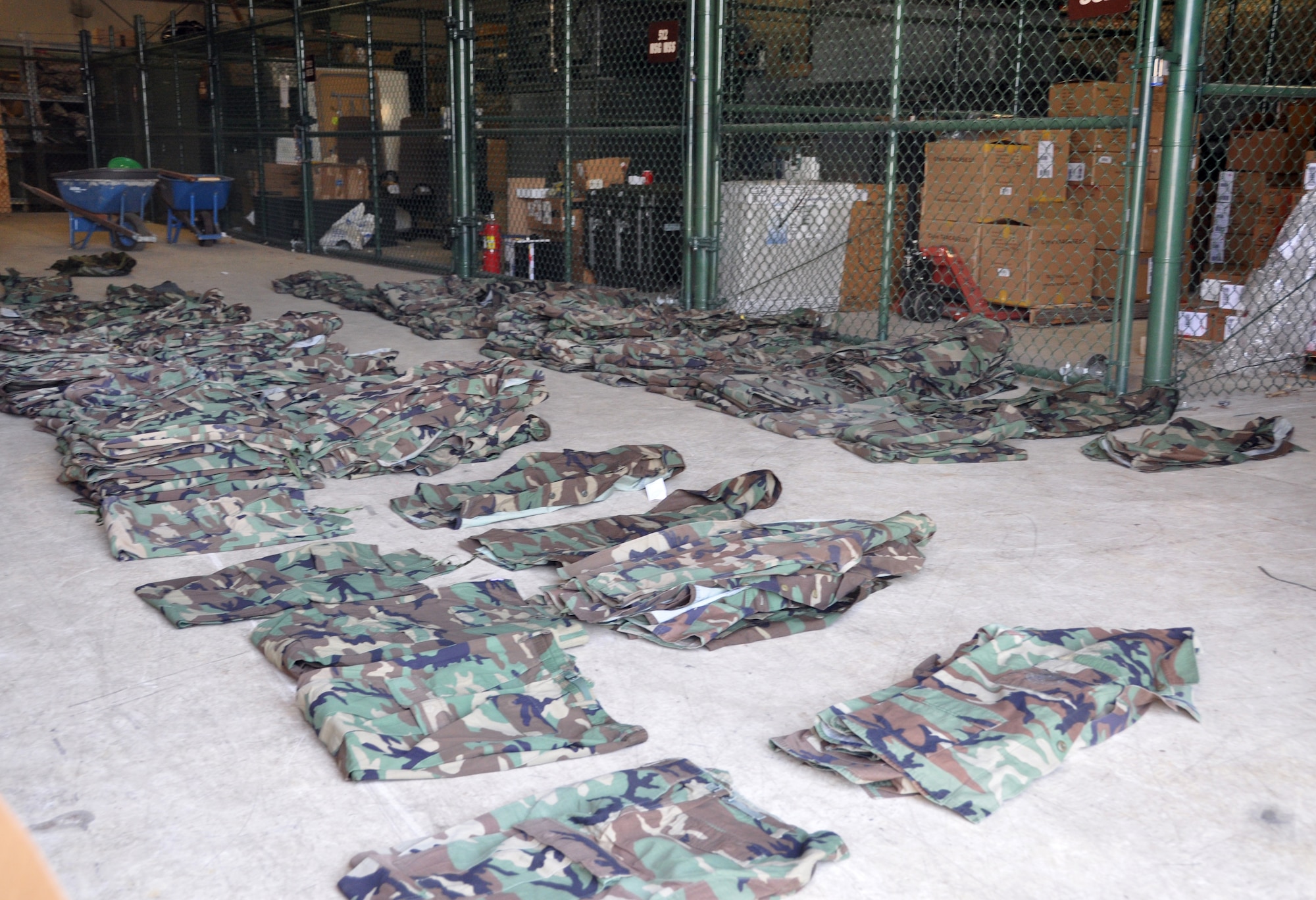 Hundreds of battle dress uniform pants and shirts, sorted by size, lay in a hangar on Dover Air Force Base, Del., Jan. 8, 2012, awaiting pick-up from two regional Civil Air Patrol units. Following the BDU phase-out in November 2011, the 512th Top 3 Association held a collection drive for the CAP units, which are still authorized to wear BDUs. (U.S. Air Force photo by Master Sgt. Veronica Aceveda)