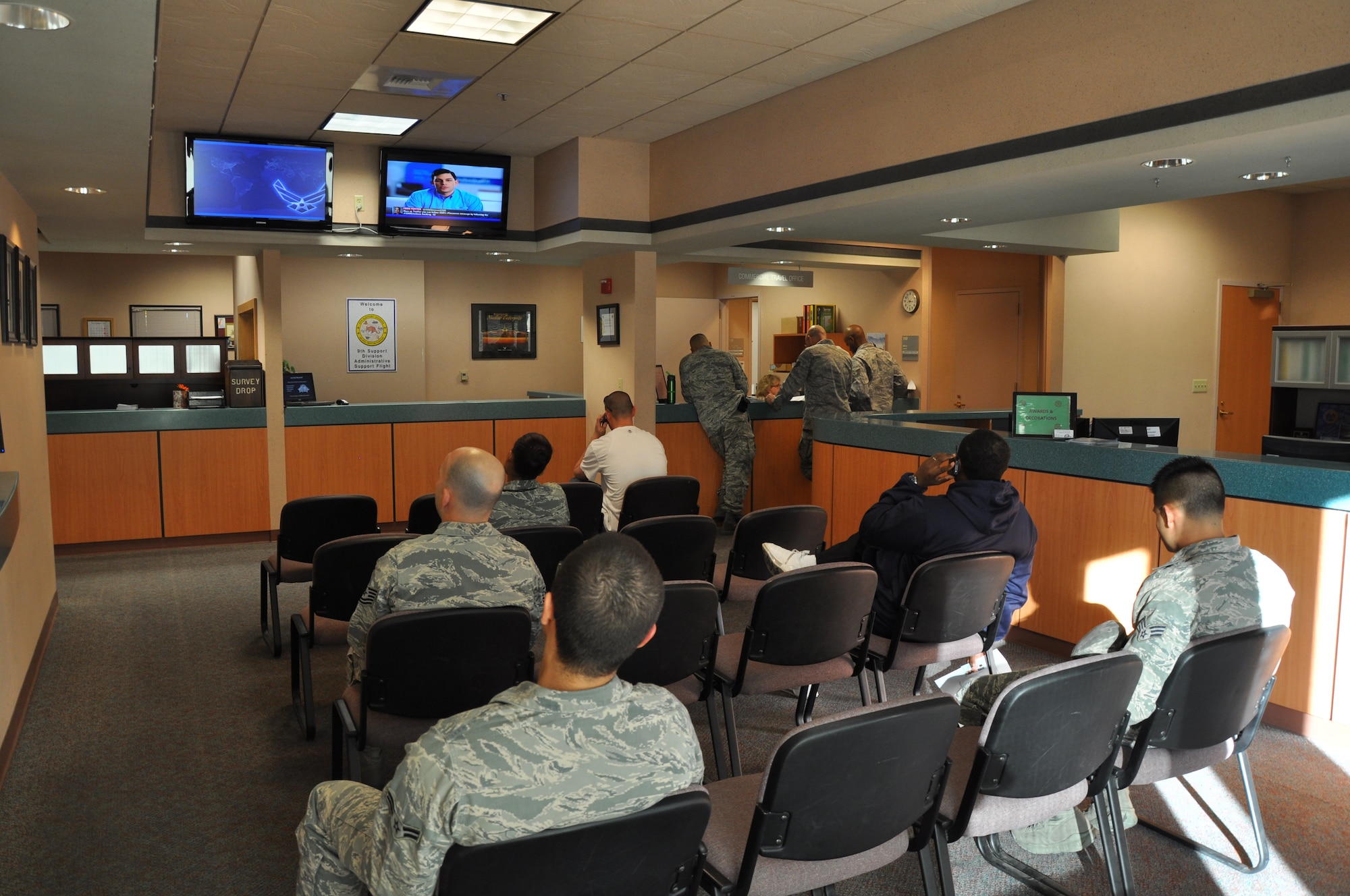 Members of Team Beale wait in a newly designed customer lobby layout at the Administrative Support Flight office at Beale Air Force Base, Calif., Jan. 3, 2012. The idea for the new lobby came from customer and staff feedback. (U.S. Air Force photo by Staff Sgt. Robert M. Trujillo)