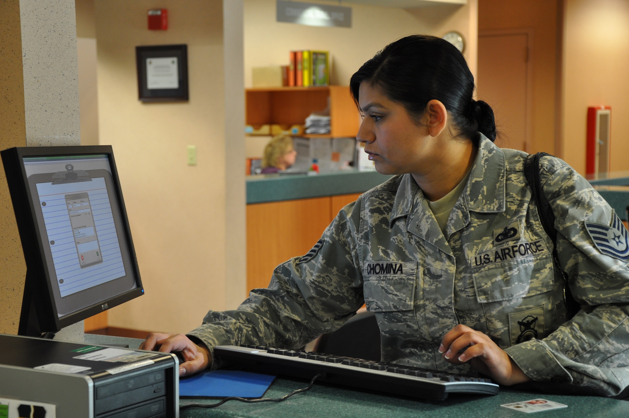 Tech. Sgt. Cristina Chomina, 9th Security Forces Squadron, uses a computer at the Administrative Support Flight at Beale Air Force Base, Calif., Jan. 5, 2012. The ASF utilizes computers to reduce customer wait time and improve customer service. (U.S. Air Force photo by Staff Sgt. Robert M. Trujillo)