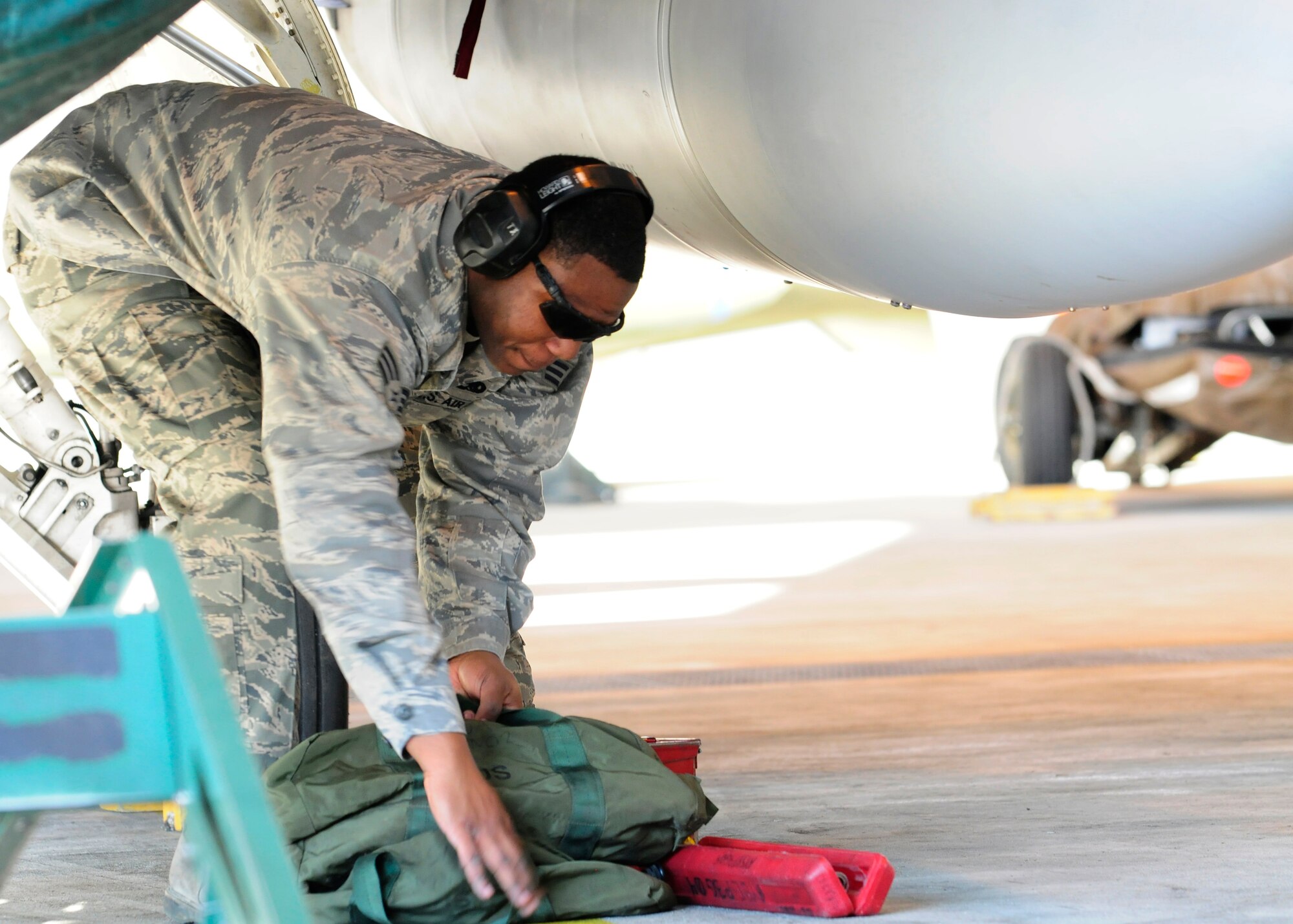 Senior Airman Julius Thomas, 31st Maintenance Group weapons load crew member, gathers his tools during a fourth quarter loading competition Jan.6 at Aviano Air Base, Italy. The competition was between the 510th and the 555th Fighter Squadrons in which the 510th won. (U.S. Air Force photo/Airman 1st Class Briana Jones)
