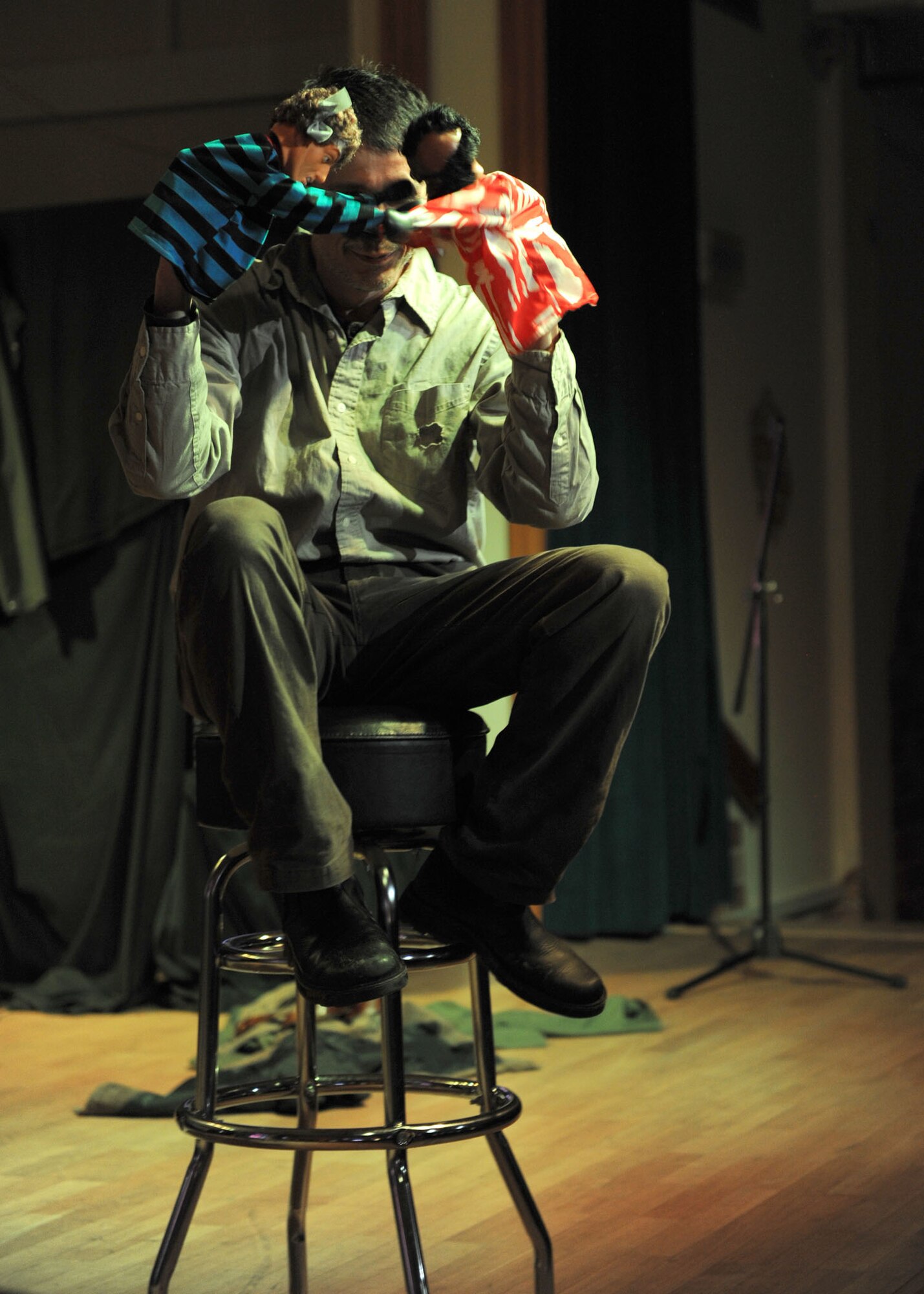 SPANGDAHLEM AIR BASE, Germany – Comedian Rusty Dooley, performs during an Armed Forces Entertainment show at the Brick House here Jan. 9. Dooley used props, costumes and dolls throughout his performance to entertain the audience. AFE provides entertainment to U.S. military members overseas hosting more than 1,200 shows around the world each year. (U.S. Air Force photo / Senior Airman Christopher Toon)

