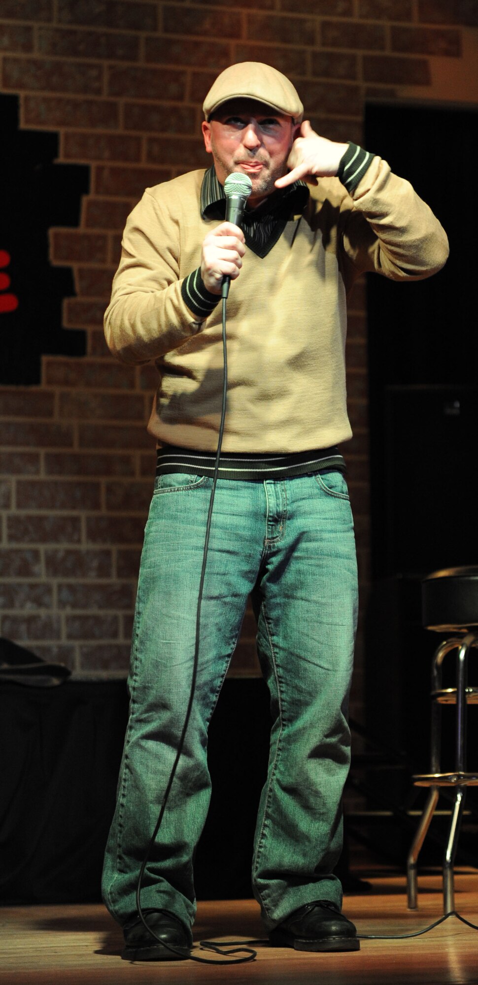 SPANGDAHLEM AIR BASE, Germany – Comedian Bryan Ricci, who has been doing stand-up comedy for more than 10 years, performs during an Armed Forces Entertainment show at the Brick House here Jan. 9. AFE provides entertainment to U.S. military members overseas hosting more than 1,200 shows around the world each year. (U.S. Air Force photo / Senior Airman Christopher Toon)
