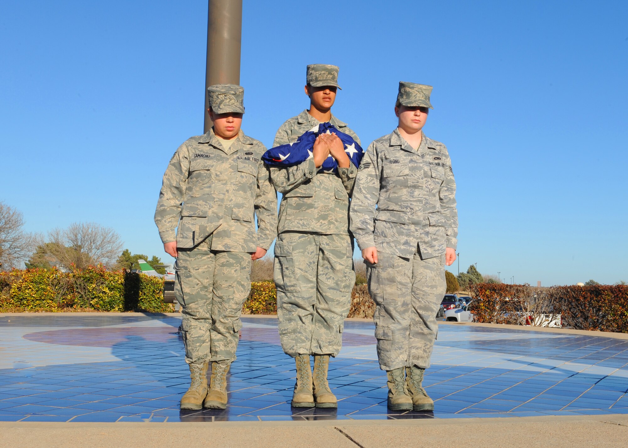 Dyess Honor Guardsmen prepare to present the flag during a retreat ceremony, Jan. 6, 2012, at Dyess Air Force Base, Texas.  A retreat ceremony signifies the end of a duty day and is also a way to pay tribute to the American flag. (U.S. Air Force photo by Airman 1st Class Cierra Bullock/Released) 