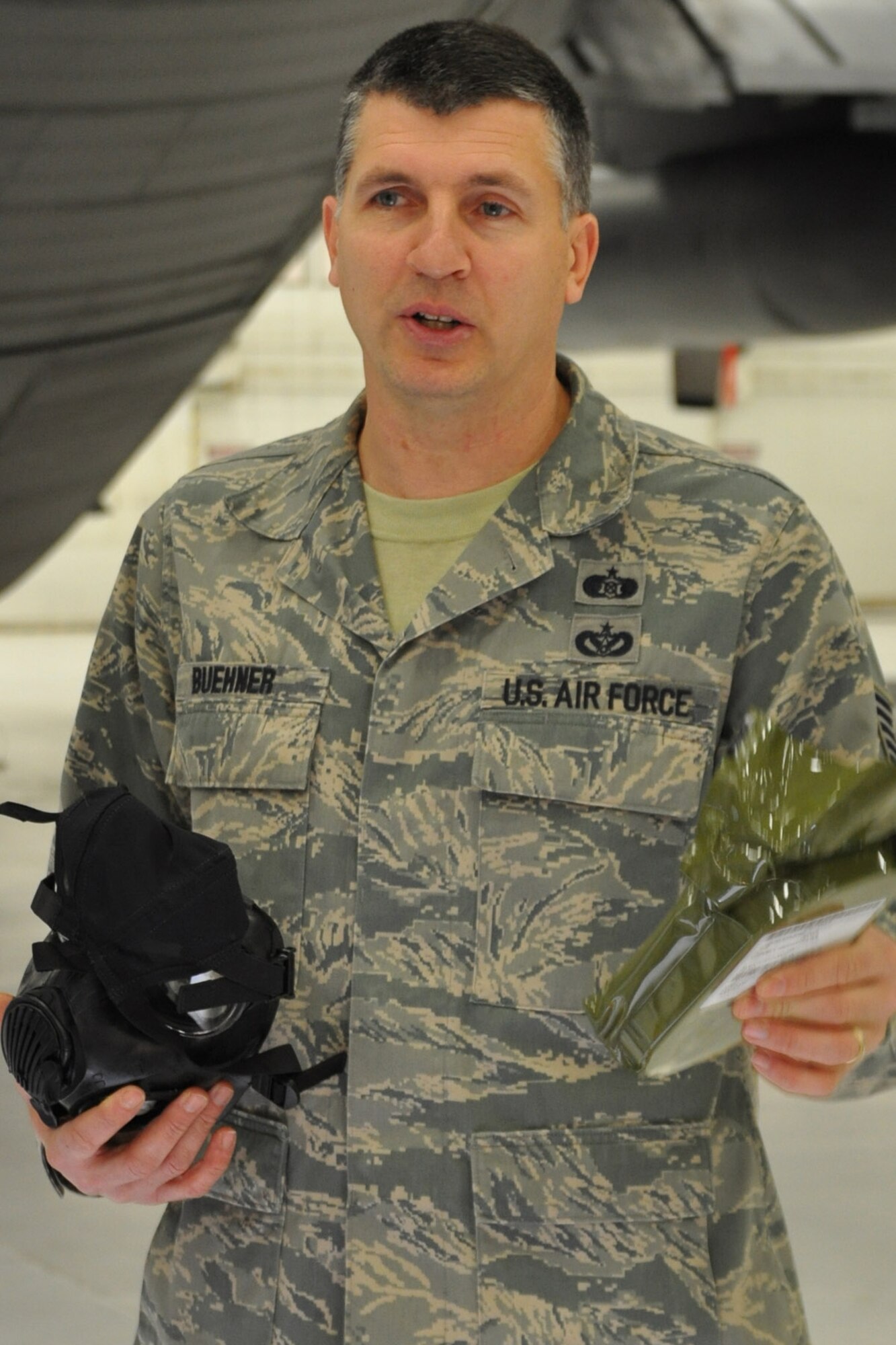 Air Force Reserve Tech. Sgt. Francis J. Buehner Jr., an Emergency Management Craftsman with the 910th Civil Engineer Squadron, talks about the features of the M50 Joint Service General Purpose Mask during a training session here Jan. 8.  