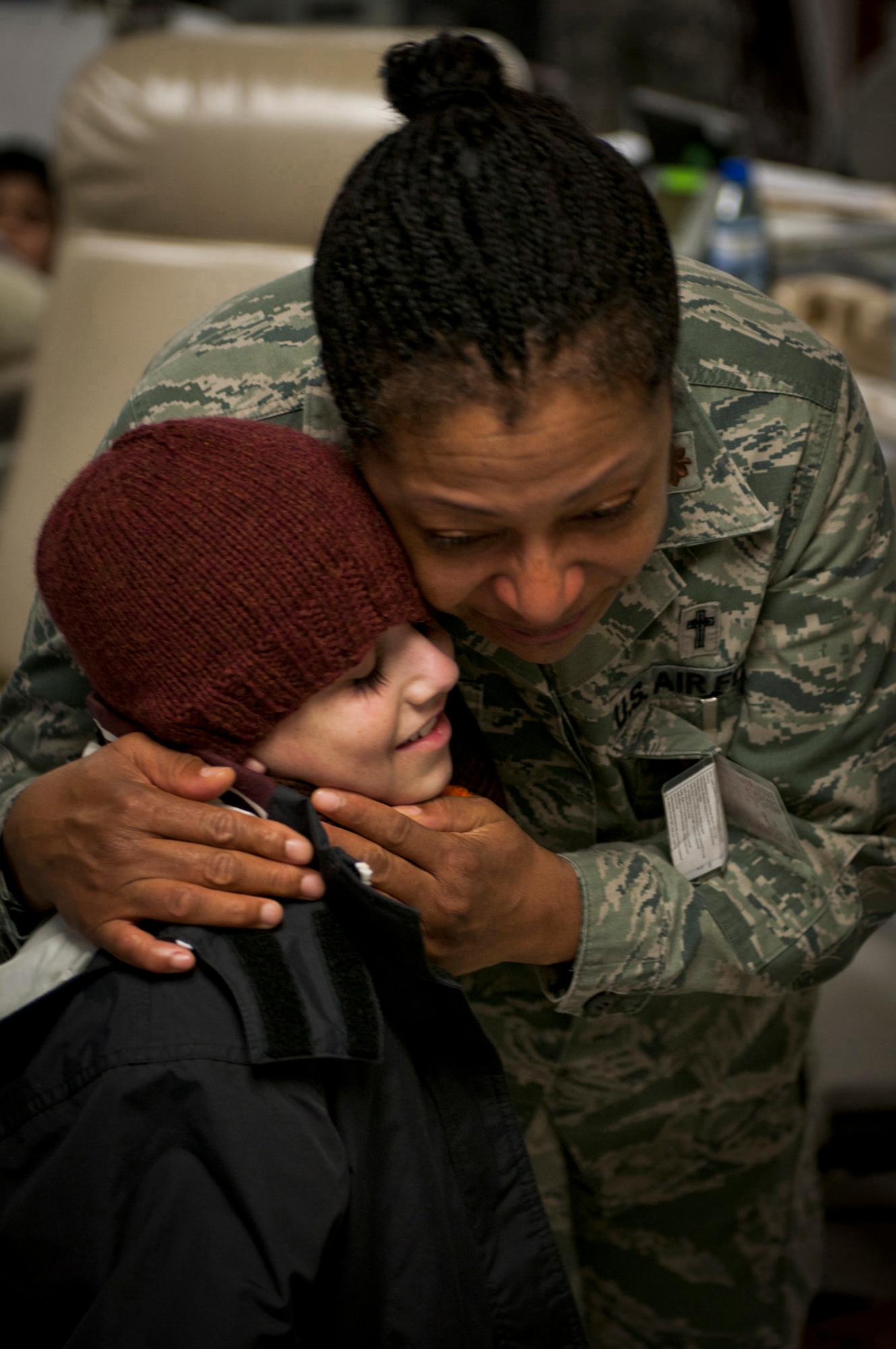 Maj. Sherrol James cries as she hugs Najibullah goodbye Jan. 9, 2012, at the Craig Joint-Theater Hospital. Najibullah suffered a severe stomach injury July 20, 2011, in Ghazni province and had been under the care of the hospital ever since. James is the chaplain at the Craig Joint-Theater Hospital. (U.S. Army photo/Spc. Ken Scar)