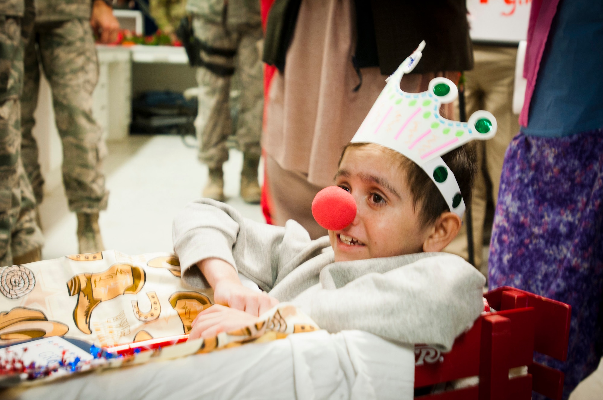Najibullah, 10, performs his duties as the grand marshal of the Craig Joint-Theater Hospital on Jan. 1, 2012, during a New Year's Day parade. He was severely injured in the stomach July 20, 2011, in Ghazni province. (U.S. Army photo/Spc. Ken Scar)