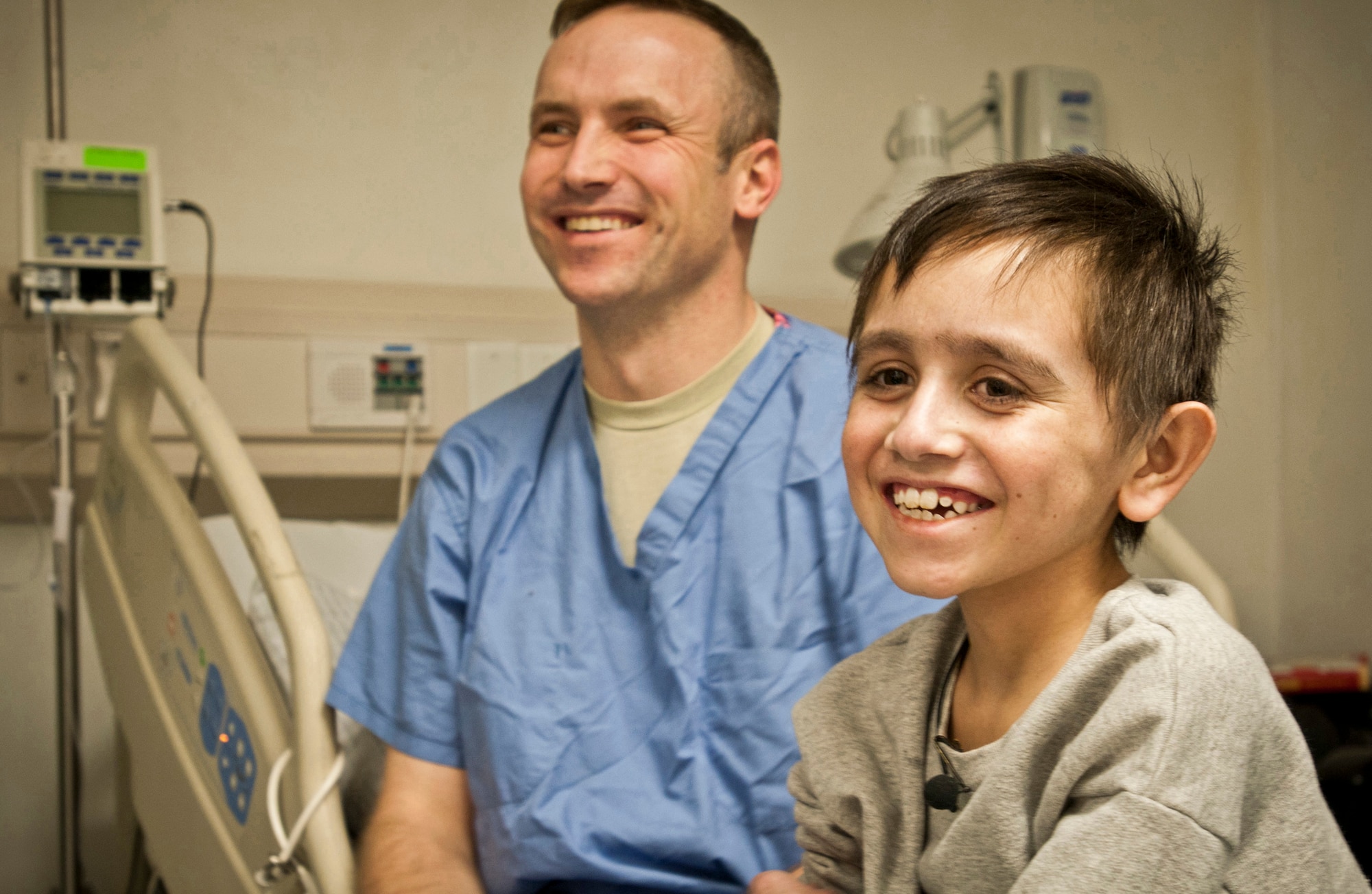 Najibullah, 10, shares a laugh with Maj. (Dr.) Joe DuBose on Jan. 1, 2012, his 164th day under the hospital's care. Najibullah was severely injured in the stomach July 20, 2011, in Ghazni province. DuBose is the trauma chief at the Craig Joint-Theater Hospital in Afghanistan. (U.S. Army photo/Ken Scar)