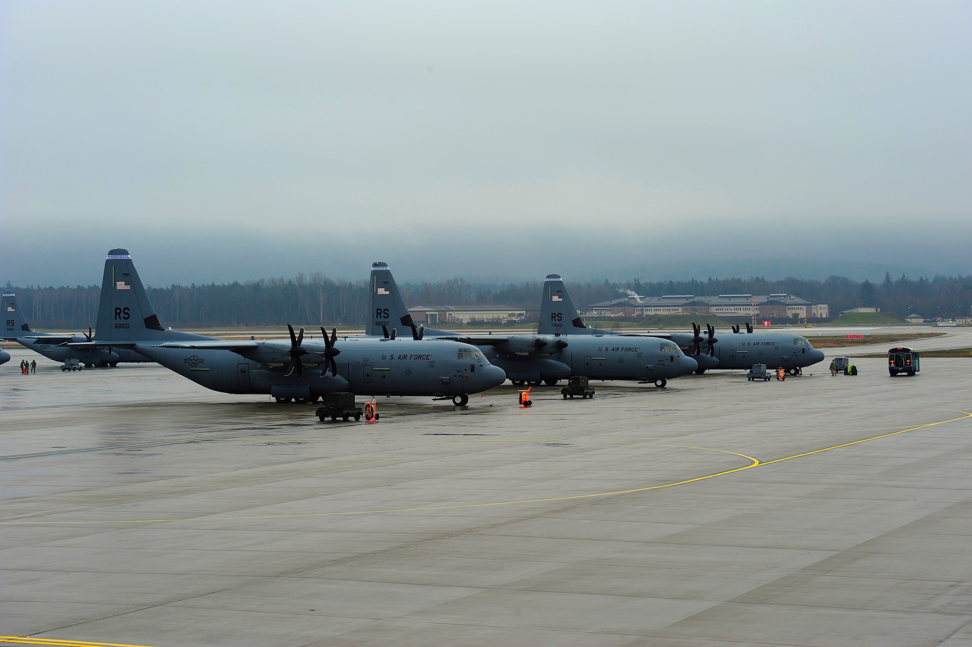 C-130J "Super Hercules" cargo aircraft from the 37th Airlift Squadron are parked during pre-flight inspections at Ramstein Air Base, Germany, Jan. 9, 2012. The Hercules family of aircraft has the longest continuous production run of any military aircraft in history, totaling more than 50 years of service. (U.S. Air Force photo by Senior Airman Stephen J. Otero)