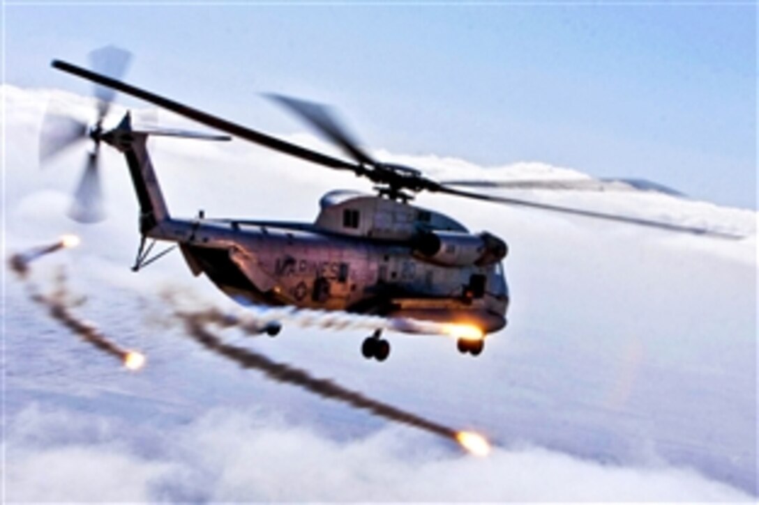 A U.S. Marine Corps CH-53D Sea Stallion helicopter discharges flares during a routine flight operation in Afghanistan's Helmand province, Jan. 5, 2012. The CH-53D crew, assigned to Marine Heavy Helicopter Squadron 363, uses flares to ensure the safety of the crew onboard and safeguarding the aircraft while in flight during poor visibility weather.