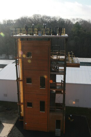 Soldiers from 911th U.S. Army Technical Rescue Engineer Company and Marines from Chemical Biological Incident Response Force's Technical Rescue Platoon prepare for a high-angle rescue between Downey Responder Training Facility's two repel and rescue-trainer towers during CBIRF's annual 72-hour technical rescue training operation. The two units take the opportunity to train together to build a good working relationship and familiarity of each other’s capabilities and limitations because both units cover the National Capitol Region, they would work together if there were ever a disaster.