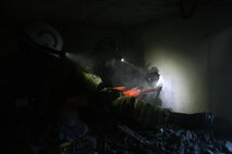 A soldier from 911th U.S. Army Technical Rescue Engineer Company and a Marine from Chemical Biological Incident Response Force’s Technical Rescue Platoon use a jack hammer in a very cramped tunnel to break through a wall of concrete to gain access to a "victim" trapped in a void during the first day of the joint 72-hour technical rescue training operation with the 911th Engineer Battalion, Technical Rescue Detachment at Downey. The two units take the opportunity to train together to build a good working relationship and familiarity of each other’s capabilities and limitations because they both cover the National Capitol Region and would have to work together if there were ever a disaster.