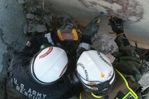 A soldier from 911th U.S. Army Technical Rescue Engineer Company and a Marine with Chemical Biological Incident Response Force’s Technical Rescue Platoon asses the condition of the void on the opposite side of a concrete barrier before breaking through to potentially rescue trapped victims in the void of a simulated collapse. This joint 72-hour technical rescue training operation with the 911th U.S. Army Technical Rescue Engineer Company at Downey Responder Training Facility allowed the two units take the opportunity to train together to build a good working relationship and familiarity of each other’s capabilities and limitations. Since both units cover the National Capitol Region, in the event of a disaster both units would work side by side.