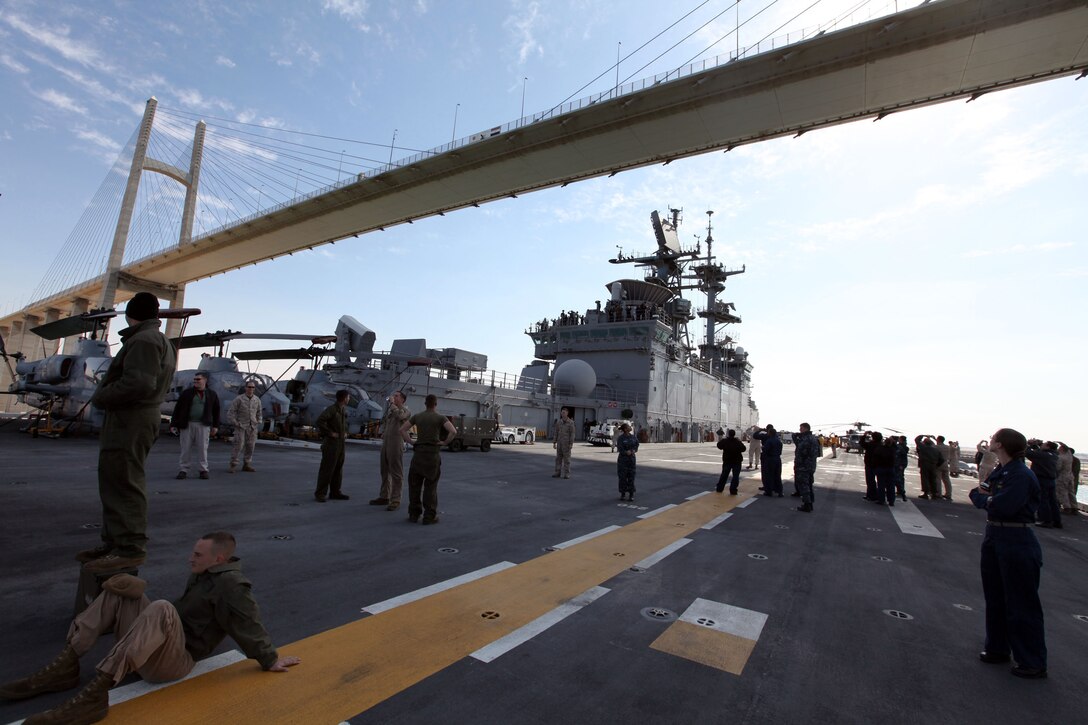 Marines and sailors, with the 22nd Marine Expeditionary Unit and USS Bataan, admire the Egyptian-Japanese Friendship Bridge as the ship passes through the Suez Canal, Jan. 10, 2012.   The 22nd MEU and Bataan Amphibious Ready Group crossed the Suez Canal into the Mediterranean after more than four months in the 5th fleet area of responsibility. The Marines and sailors of the 22nd MEU are currently deployed with Amphibious Squadron 6 aboard the USS Bataan Amphibious Ready Group.  The 22nd MEU is a multi-mission, capable force, comprised of an Aviation Combat Element, Marine Medium Tilt Rotor Squadron 263 (Reinforced); a Logistics Combat Element, Combat Logistics Battalion 22; a Ground Combat Element, Battalion Landing Team, 2nd Battalion, 2nd Marine Regiment; and its Command Element.