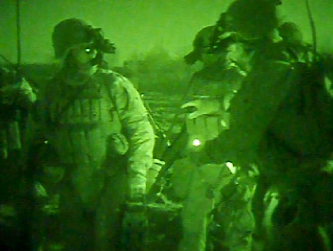 Corporal George W. Casey (right), a 29-year-old squad leader with 3rd Platoon, counts off Marines from his platoon to gain accountability as they prepare for a recent night extract. Casey led his squad while clearing multiple objectives and performing various other tasks during Operation Double Check, an operation to promote legitimate governance and security within the Musa Qal’eh district. Casey belongs to Echo Company, 2nd Battalion, 4th Marine Regiment, and is on his second combat deployment to Afghanistan.::r::::n::::r::::n::::r::::n::