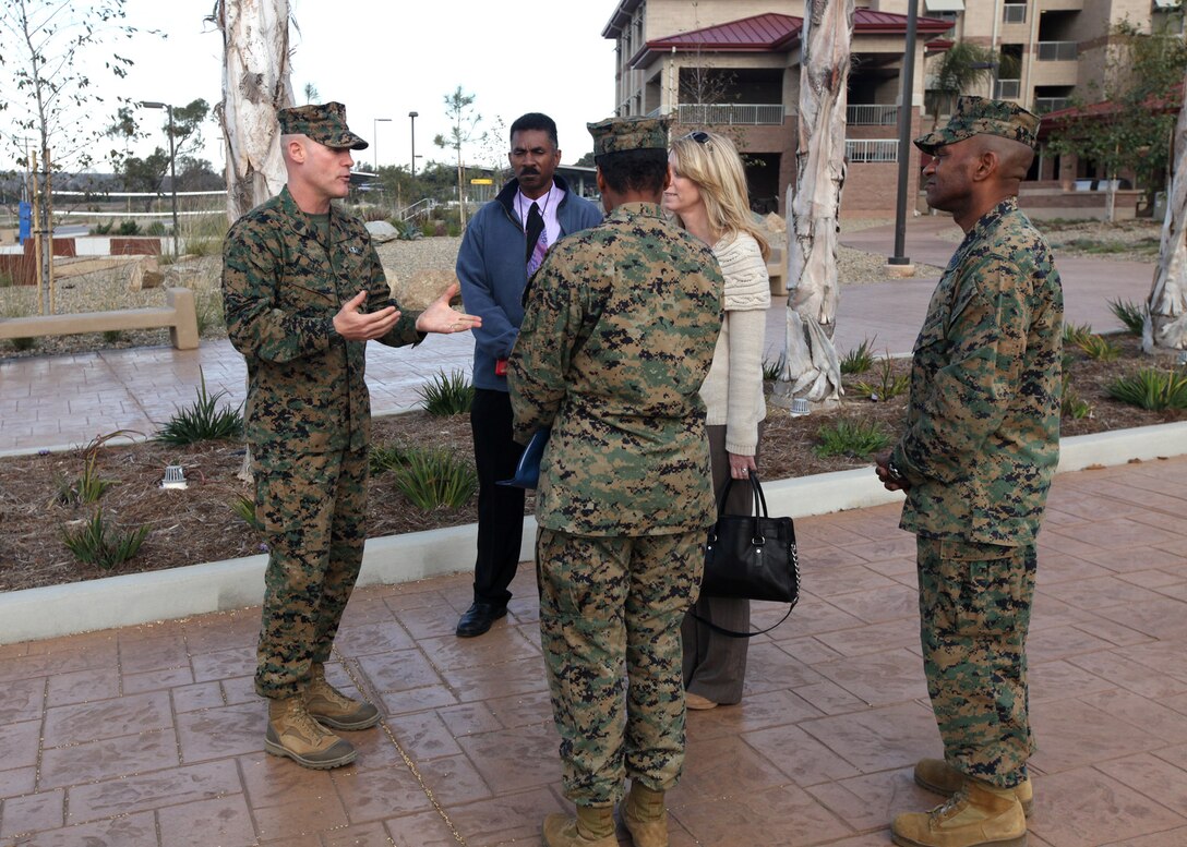 Sergeant Major of the Marine Corps Micheal P. Barrett, visits with Monique Ramirez, the director of billeting for bachelor housing, following a tour of bachelor enlisted quarters at Camp Pendleton, Calif., Jan. 11. Barrett visited the barracks to observe the living facilities.