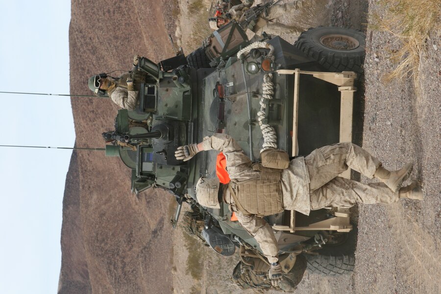 U.S. Marine Corps Sgt. Jhonny Agudelo, assigned to the Marine detachment embarked aboard high speed vessel Swift (HSV-2), waits to give instructions to Guatemalan paratroopers before they shoot their weapons on a 25-meter range in Puerto Quetzal, Guatemala, Jan. 11, 2012, during High Speed Vessel-Southern Partnership Station (HSV-SPS) 2012. HSV-SPS is an annual deployment of U.S. ships to the U.S. Southern Command's area of responsibility in the Caribbean and Latin America. The exercise involves information sharing with navies, coast guards and civilian services throughout the region.