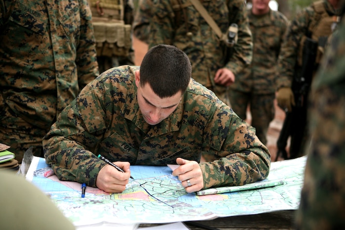 Cpl. Jason E. Fox, from Ellsworth, Maine, a bulk fuel specialist with 8th Engineer Support Battalion, 2nd Marine Logistics Group, outlines the route on a map prior to going on a convoy exercise during a Convoy Leaders Course aboard Camp Lejeune, N.C., Jan. 11, 2012. The Battle Skills Training School offers this training exercise in order to prepare units for upcoming deployments.  The class helps train Marines and sailors to be effective in convoy operations overseas where this knowledge can mean the difference between a successful and unsuccessful mission.